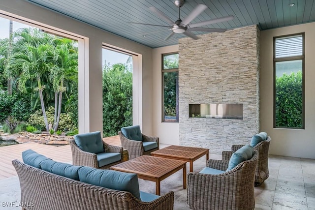 view of patio with outdoor lounge area and ceiling fan