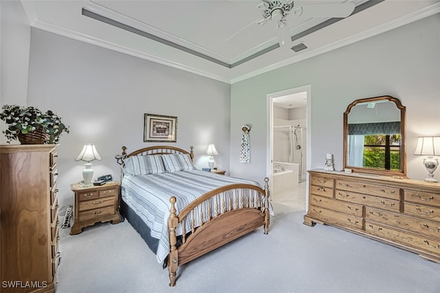 bedroom with crown molding, light carpet, and connected bathroom