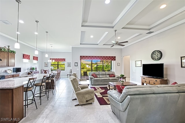 tiled living room with beam ceiling, ceiling fan, crown molding, and coffered ceiling