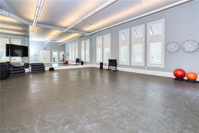 workout room featuring plenty of natural light