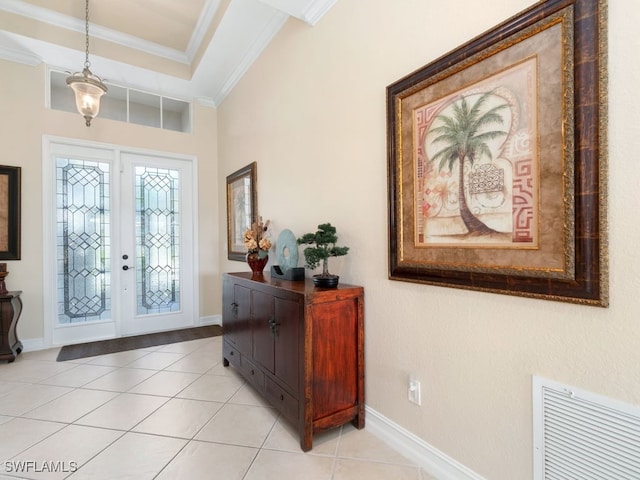 tiled foyer with crown molding