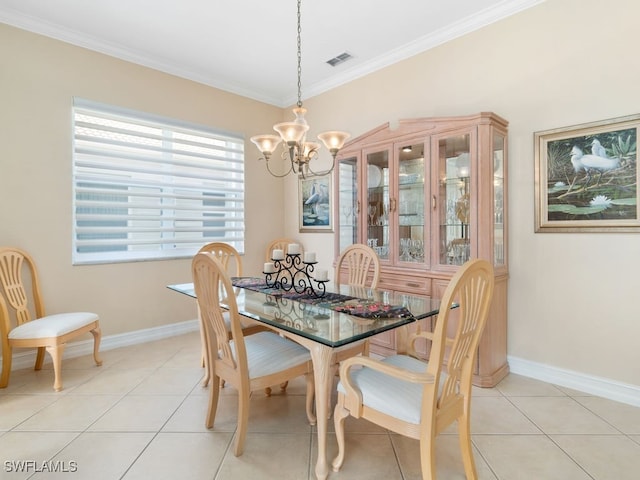 tiled dining space with ornamental molding and a chandelier