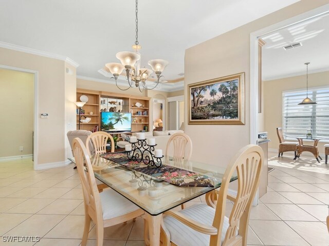 tiled dining area featuring a chandelier and ornamental molding