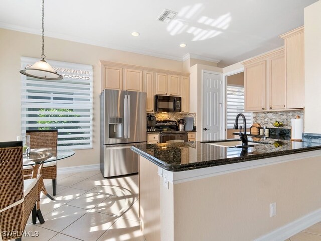 kitchen featuring kitchen peninsula, sink, light tile patterned floors, and appliances with stainless steel finishes