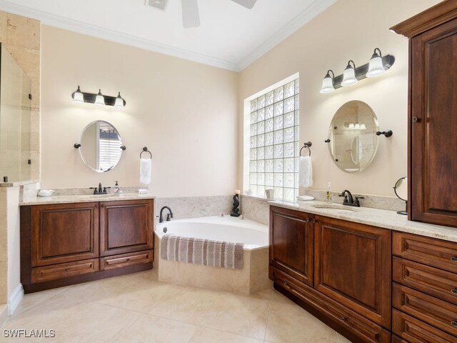 bathroom with vanity, tile patterned floors, crown molding, ceiling fan, and tiled bath