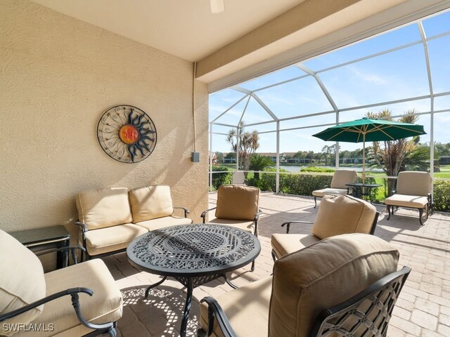 view of patio / terrace with an outdoor living space and a lanai