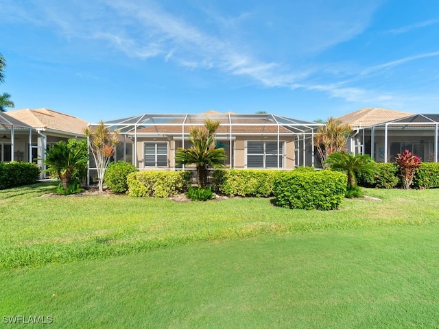 exterior space featuring a lanai and a front yard