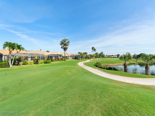 view of community featuring a yard and a water view