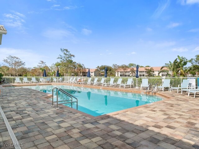 view of swimming pool featuring a patio area