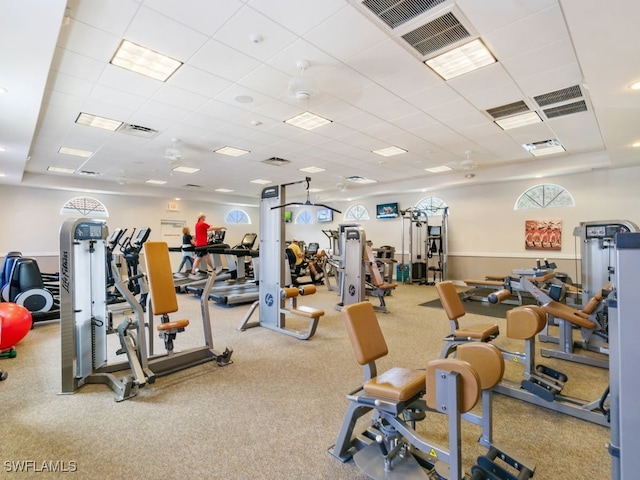 gym featuring a paneled ceiling and ceiling fan