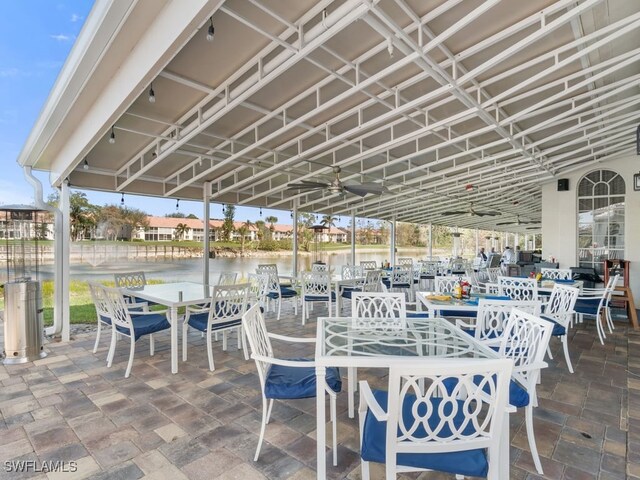 view of patio with a water view