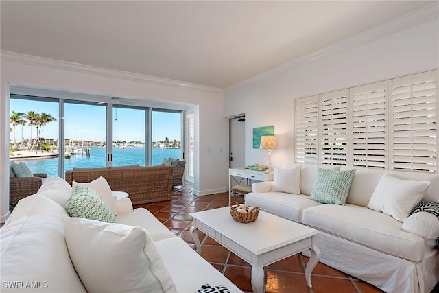 living room with tile patterned floors, crown molding, and a water view