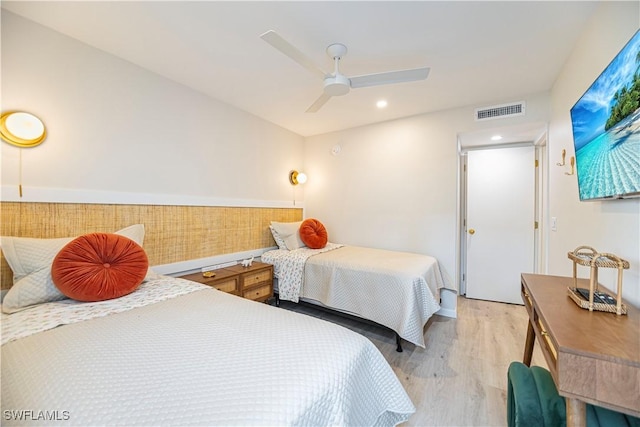 bedroom featuring light wood-type flooring and ceiling fan