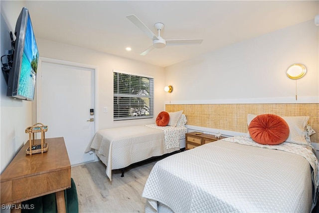 bedroom with light wood-type flooring and ceiling fan