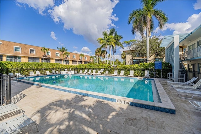 view of swimming pool featuring a patio