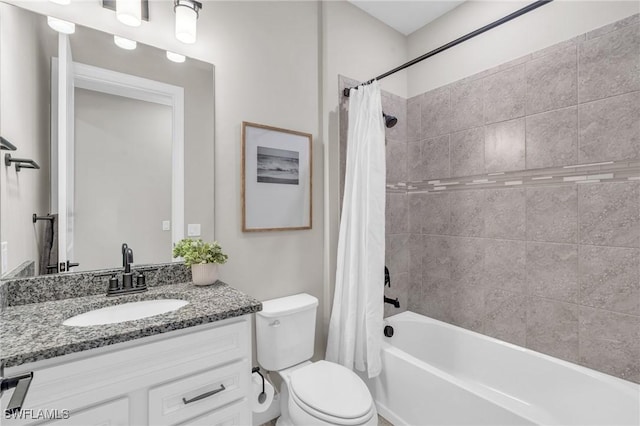 full bathroom featuring toilet, vanity, and shower / bath combination with curtain