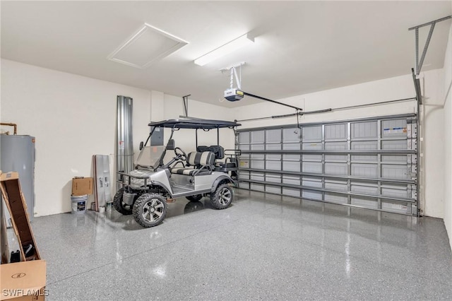 garage with water heater and a garage door opener