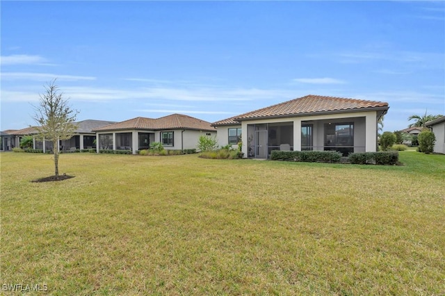 view of yard featuring a sunroom