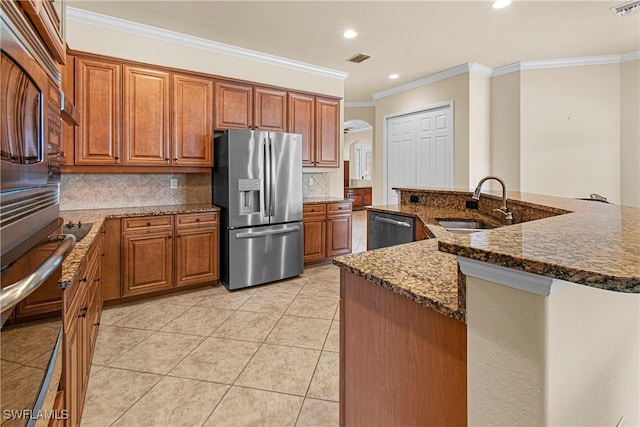 kitchen with stainless steel appliances, tasteful backsplash, light tile patterned flooring, ornamental molding, and sink