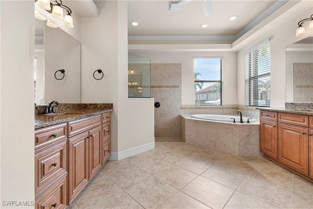 bathroom with vanity, crown molding, and separate shower and tub