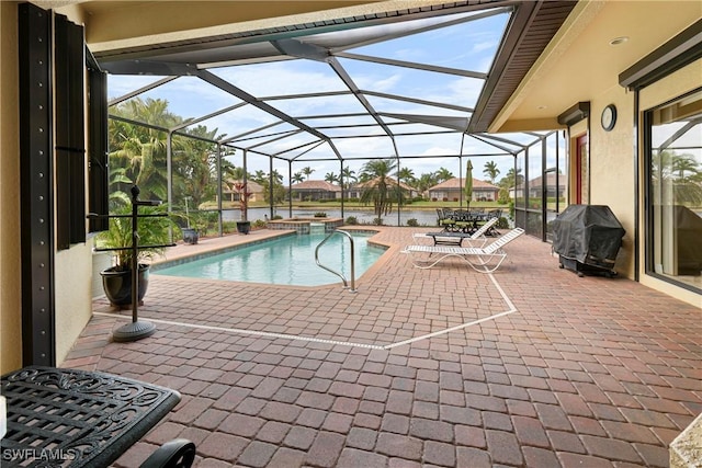 view of swimming pool with an in ground hot tub, a water view, grilling area, a lanai, and a patio