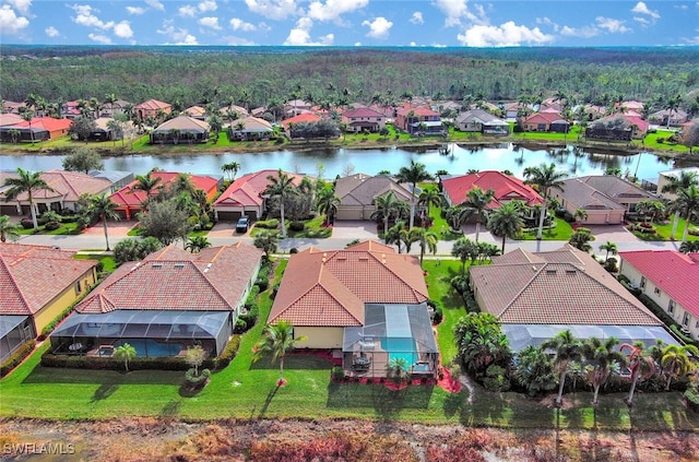 birds eye view of property with a water view