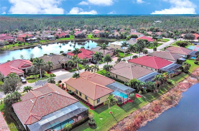 drone / aerial view with a water view