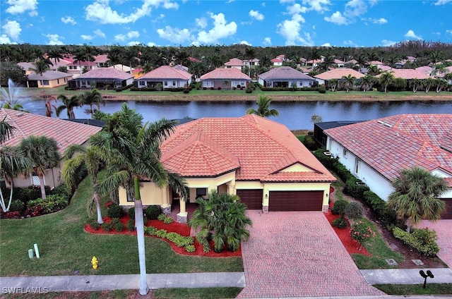 aerial view featuring a residential view and a water view