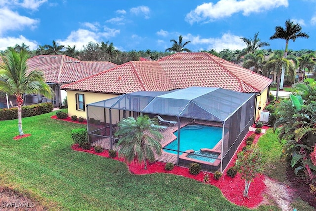 view of swimming pool with a yard and glass enclosure