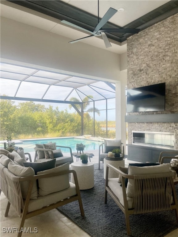 view of patio featuring an outdoor living space with a fireplace