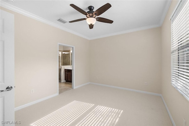 unfurnished bedroom with ensuite bathroom, ceiling fan, ornamental molding, and multiple windows