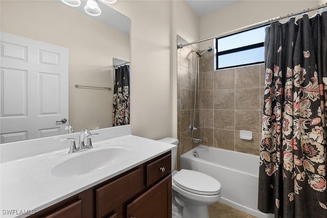 bathroom featuring vanity, toilet, and shower / bath combo with shower curtain