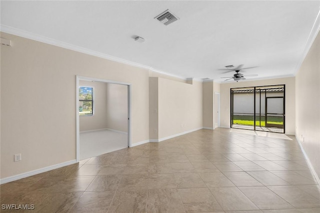 spare room featuring a ceiling fan, visible vents, ornamental molding, and baseboards