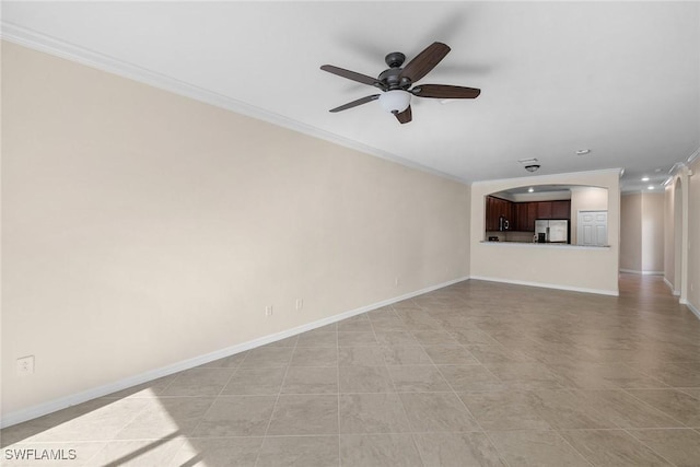 unfurnished living room featuring ornamental molding, a ceiling fan, and baseboards