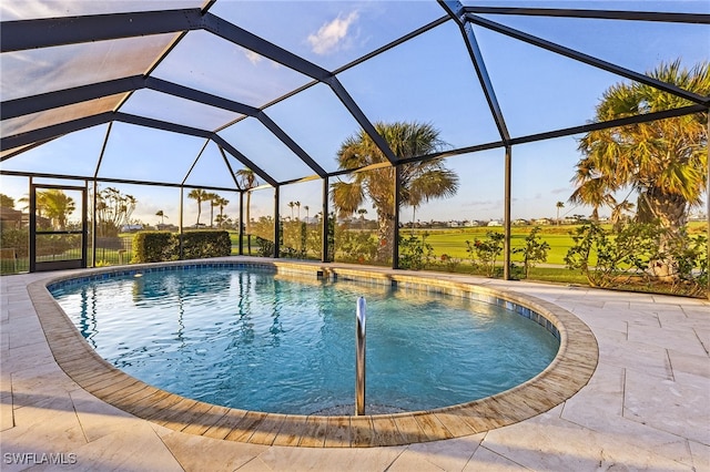 view of pool featuring a patio and a lanai