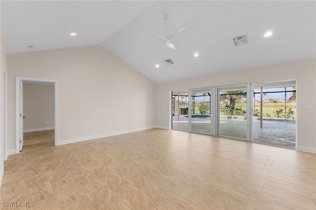 spare room with ceiling fan and high vaulted ceiling