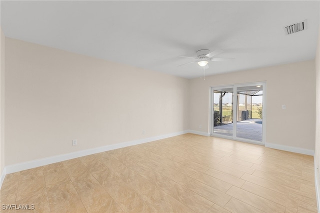 unfurnished room with ceiling fan