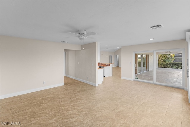 unfurnished living room with ceiling fan