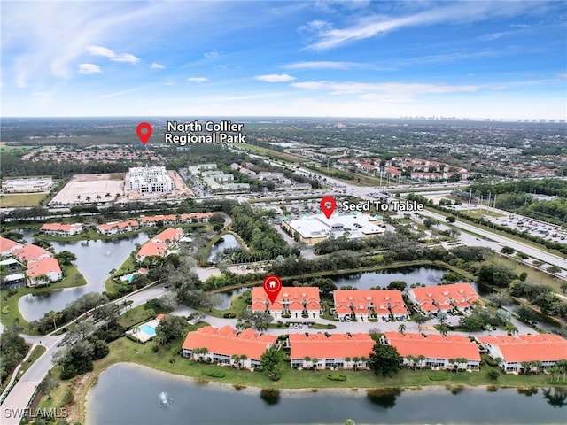 birds eye view of property featuring a water view