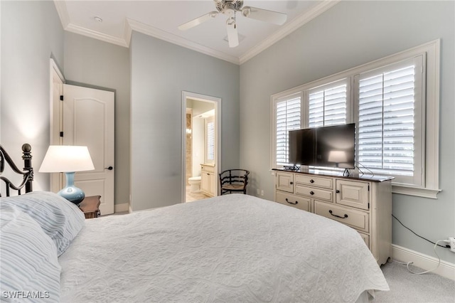 carpeted bedroom with ensuite bath, ceiling fan, and crown molding