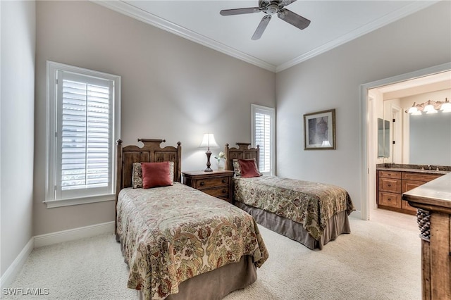 bedroom featuring ceiling fan, light colored carpet, ornamental molding, and ensuite bathroom