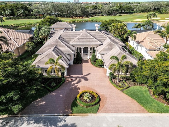 birds eye view of property with a water view