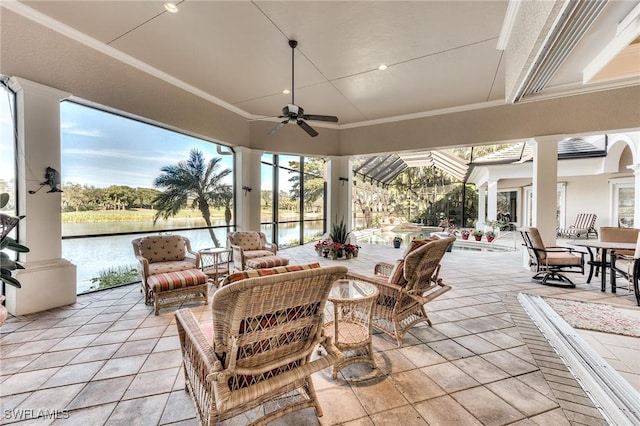 view of patio / terrace featuring ceiling fan, a water view, and an outdoor hangout area