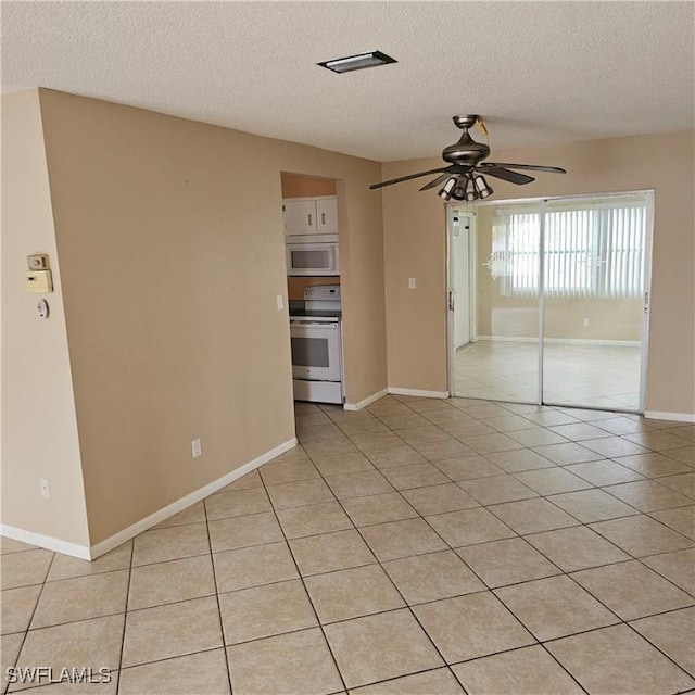 unfurnished living room with light tile patterned floors, a textured ceiling, and ceiling fan