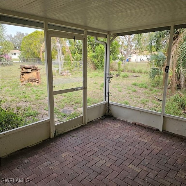 unfurnished sunroom with a wealth of natural light