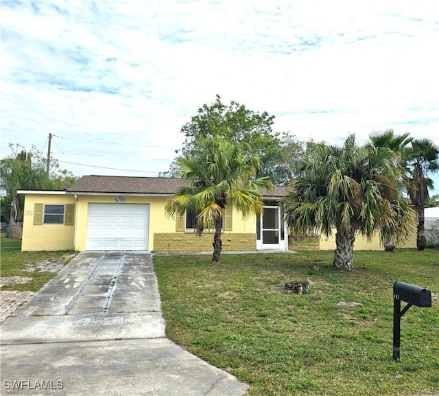 single story home with a garage and a front yard