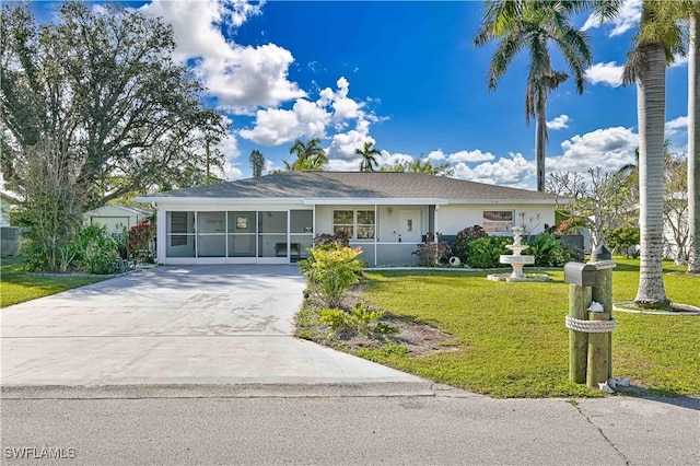 ranch-style home with a front lawn