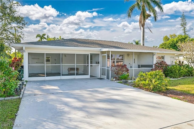 view of front of home with a sunroom