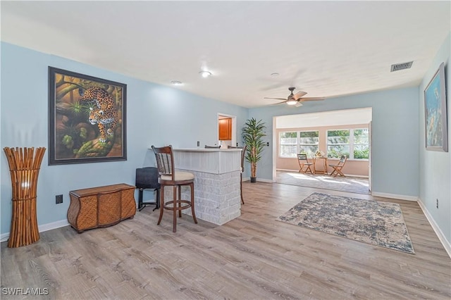 interior space featuring ceiling fan and light wood-type flooring