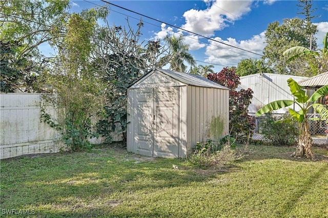 view of outbuilding featuring a yard